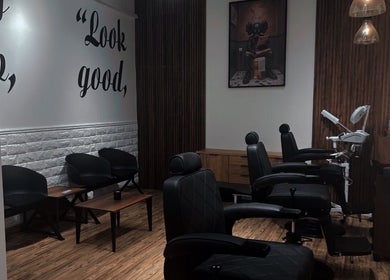 Modern interior of Lasgidi BarberShop in مسقط, Muscat Governorate, OM with chic chairs and stylish decor.