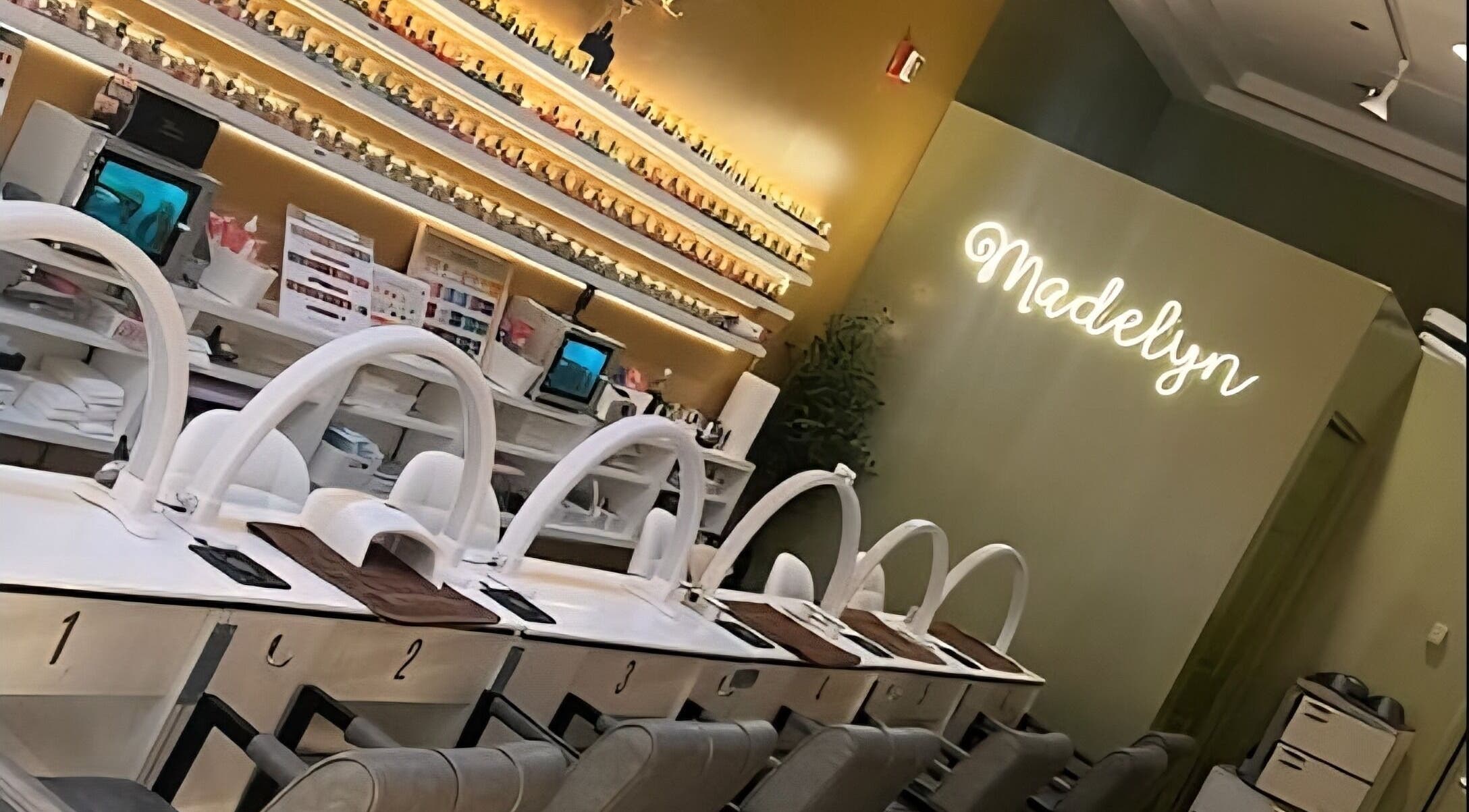 Interior of Madelyn Chicago Nail Spa with elegant manicure stations, Chicago, Illinois, US.