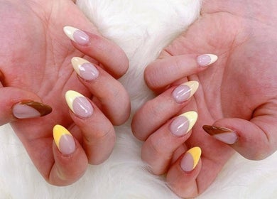 Elegant nail art at Madelyn Chicago Nail Spa, Chicago, Illinois, US featuring vibrant, multicolored designs.