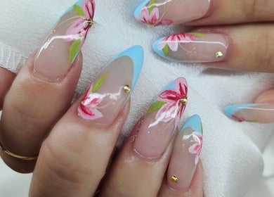 Floral nail art at Madelyn Chicago Nail Spa in Chicago, Illinois, US, showcasing detailed pink flower designs.