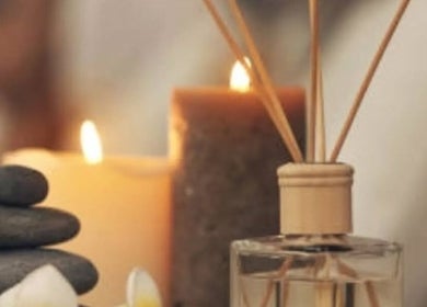 Relaxing spa setup at BeautybyBeckey, Cradley Heath, England, GB with candles and stones.