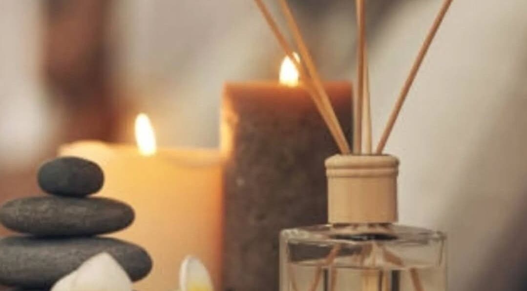 Relaxing spa setup at BeautybyBeckey, Cradley Heath, England, GB with candles and stones.