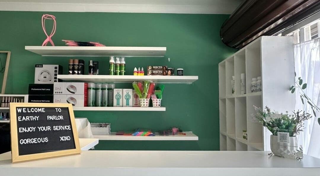 Welcome sign and products at Earthy Parlor, Windhoek, Khomas Region, NA. Inviting space with beauty essentials.