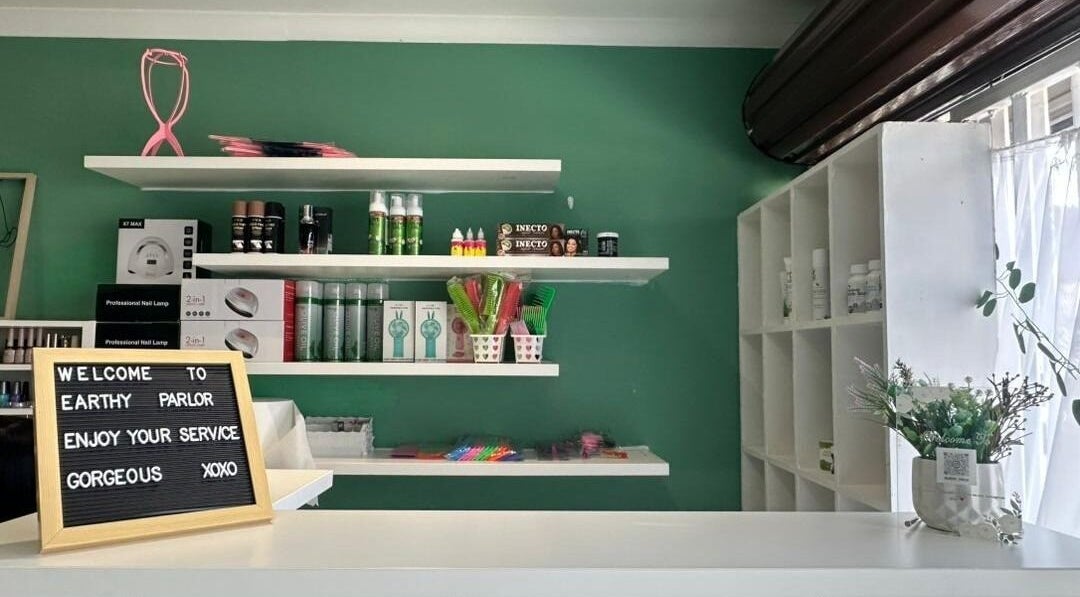 Welcome sign and products at Earthy Parlor, Windhoek, Khomas Region, NA. Inviting space with beauty essentials.