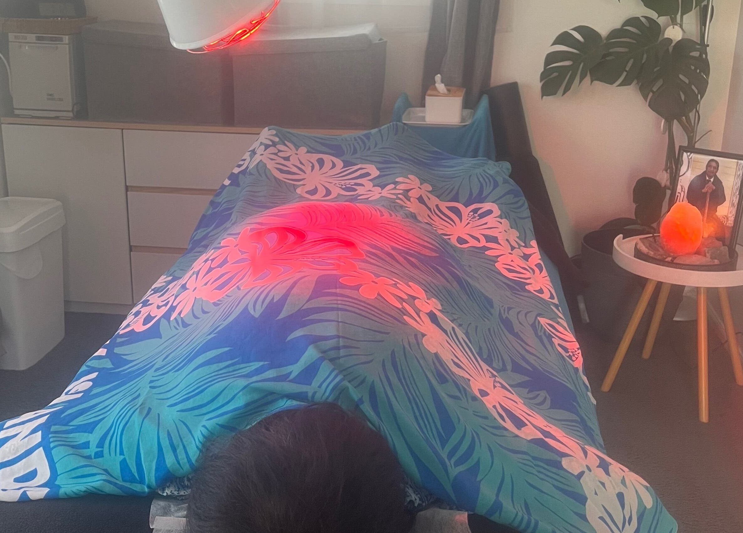Relaxing healing session at Koru Body Soul Māori Healers, Te Awamutu, Waikato, NZ with soothing red light therapy.