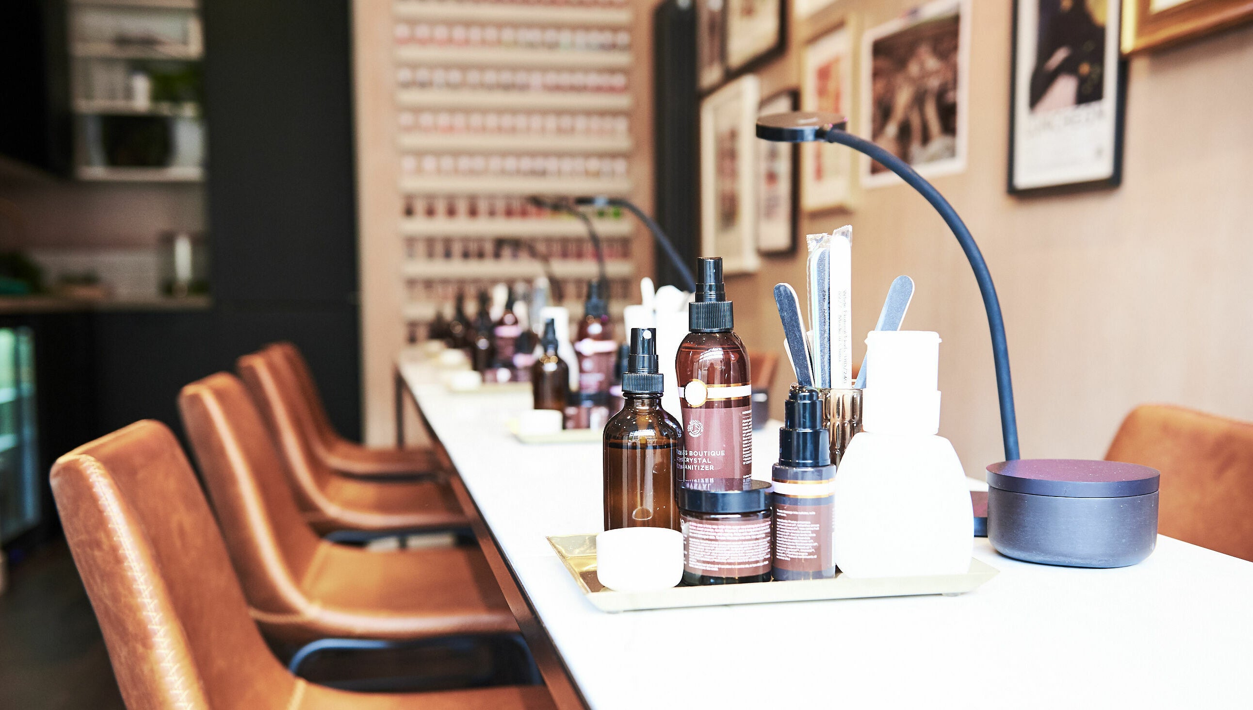 Luxurious salon setup at AMA Brixton, London. Elegant products and seating enhance wellness experience.