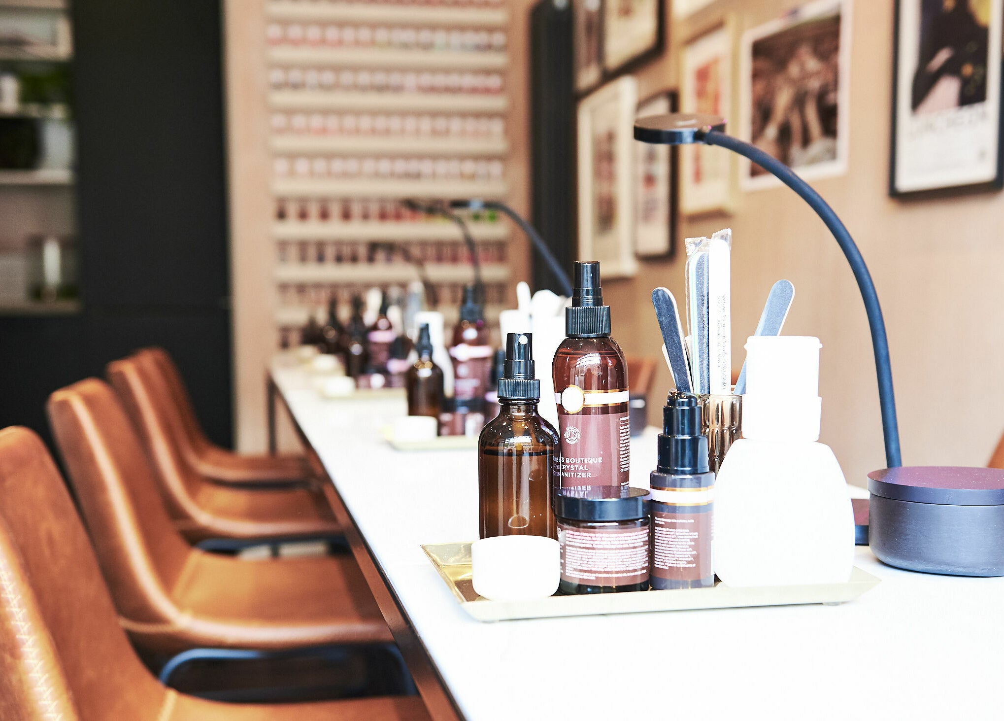 Luxurious salon setup at AMA Brixton, London. Elegant products and seating enhance wellness experience.