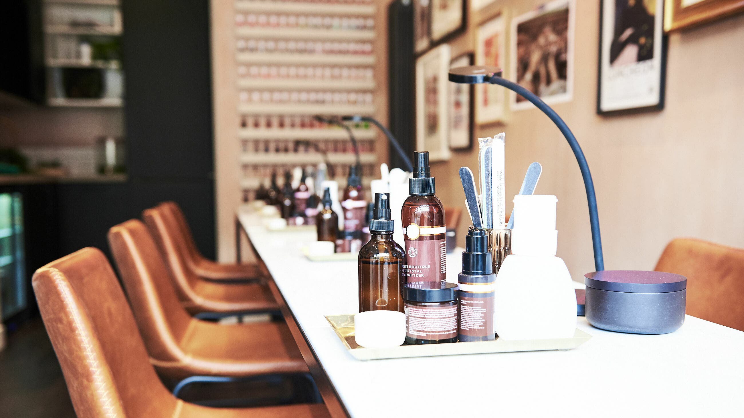 Luxurious salon setup at AMA Brixton, London. Elegant products and seating enhance wellness experience.