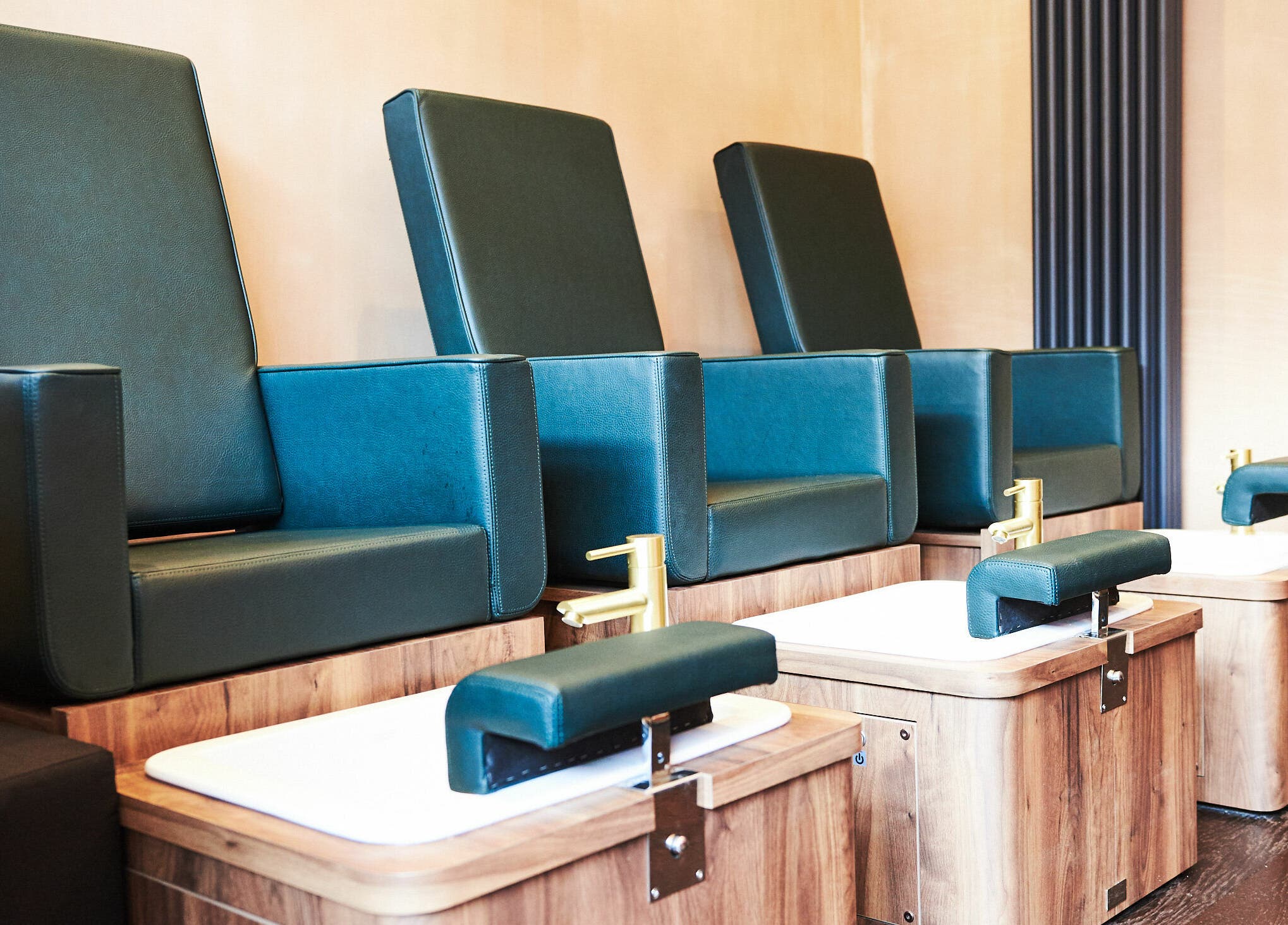 Luxurious pedicure chairs at AMA Brixton in London, England, GB offer a serene and comfortable spa experience.