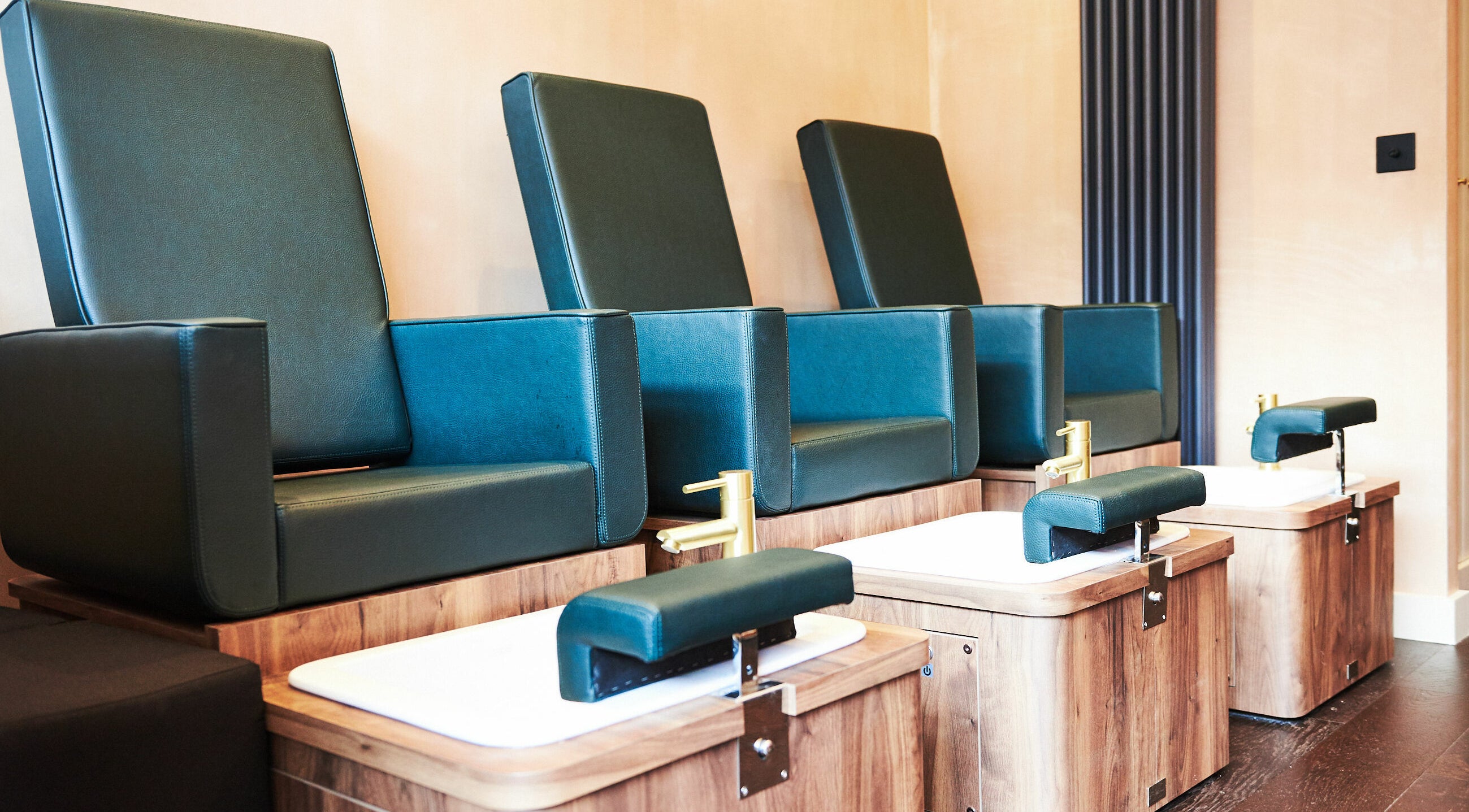 Luxurious pedicure chairs at AMA Brixton in London, England, GB offer a serene and comfortable spa experience.