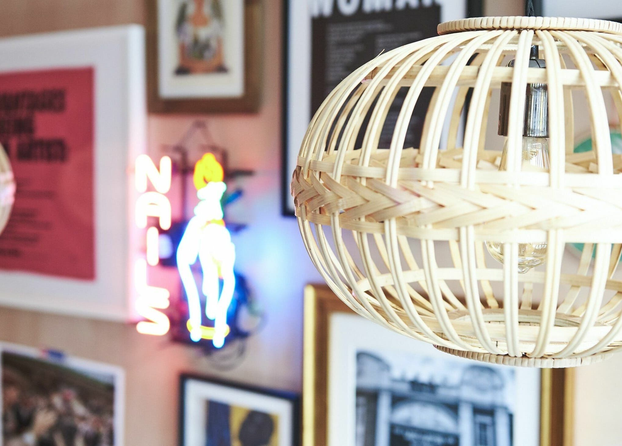 Chic decor at AMA Brixton with wicker lamp and neon sign, London, England, GB.