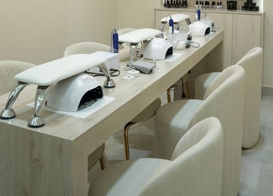 Manicure station at Aura Blend Ladies Salon, Dubai, Dubai, AE, featuring stylish chairs and sleek equipment.