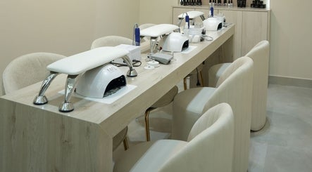 Manicure station at Aura Blend Ladies Salon, Dubai, Dubai, AE, featuring stylish chairs and sleek equipment.