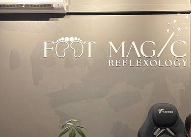 Reception area at Foot Magic Reflexology, Seri Kembangan, Selangor, MY, featuring a modern logo display.