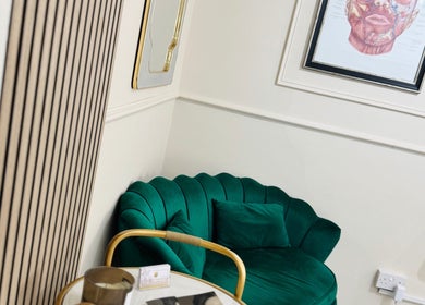 Luxurious green sofa and elegant decor at NZ Aesthetic Cosmetology, Coventry, England, GB.