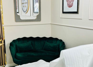 Green velvet couch and decor at NZ Aesthetic Cosmetology, Coventry, England, GB.