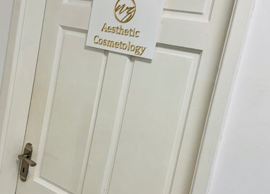 Entrance door of NZ Aesthetic Cosmetology in Coventry, England, GB with elegant signage.