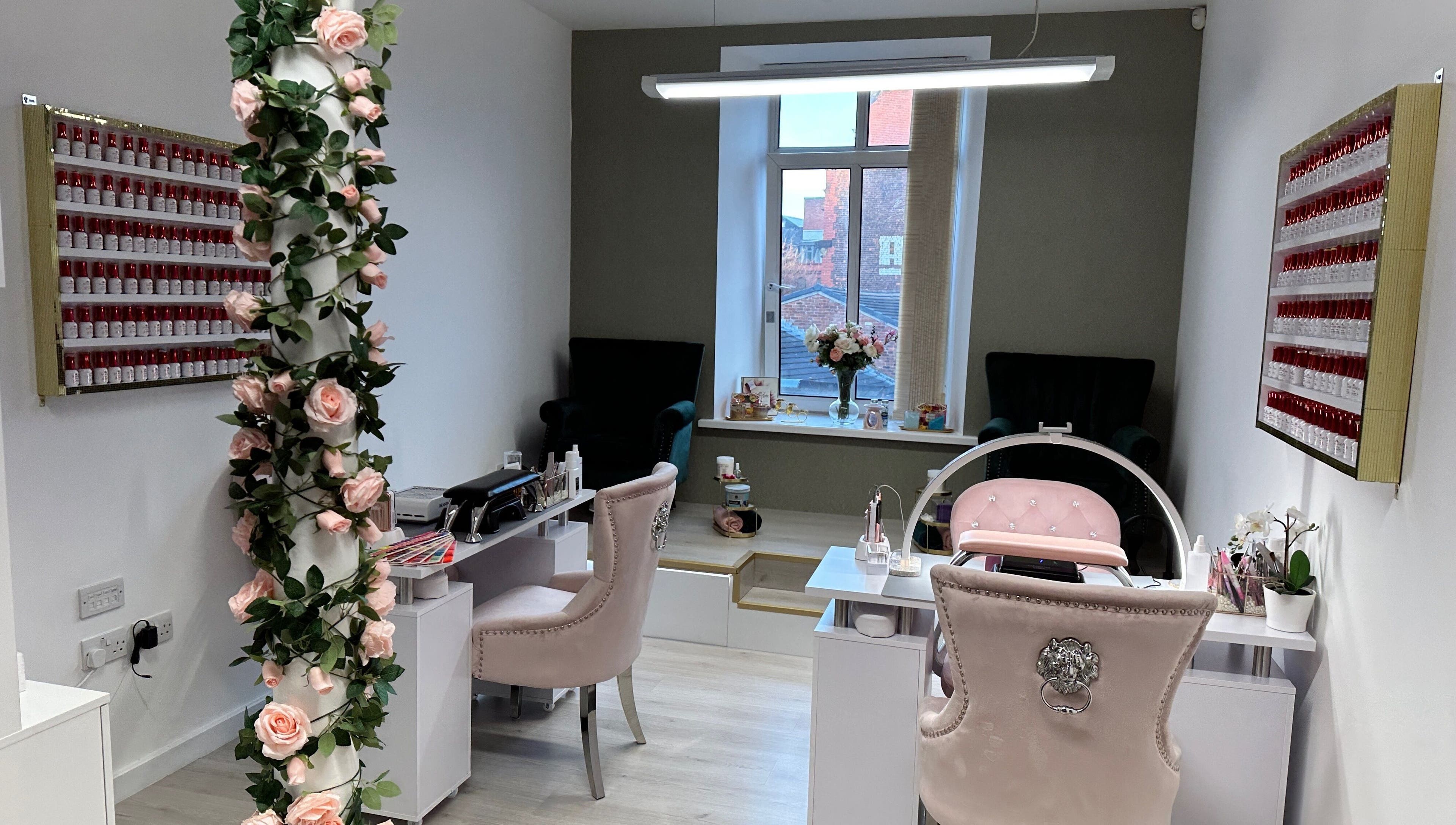 Beautiful interior of Eleganza Nails, Manchester, England, GB, showcasing chic decor and nail polish display.