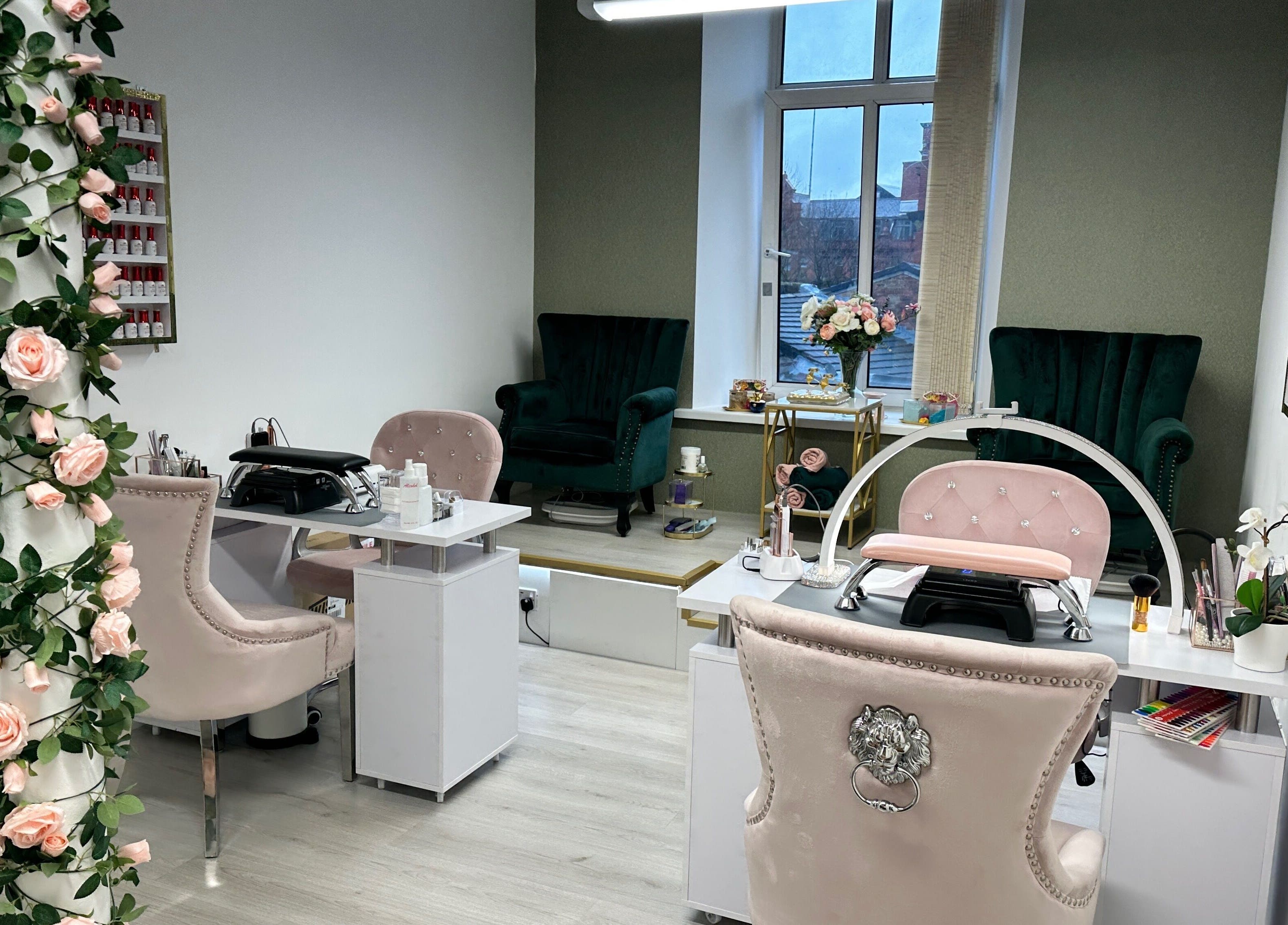 Inside Eleganza Nails in Manchester, England, GB, showcasing chic nail stations and luxurious seating.