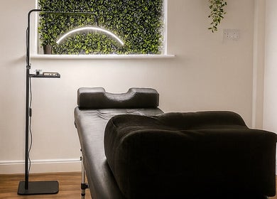 LASHD treatment room with massage bed and plant decor in Salford, England, GB.