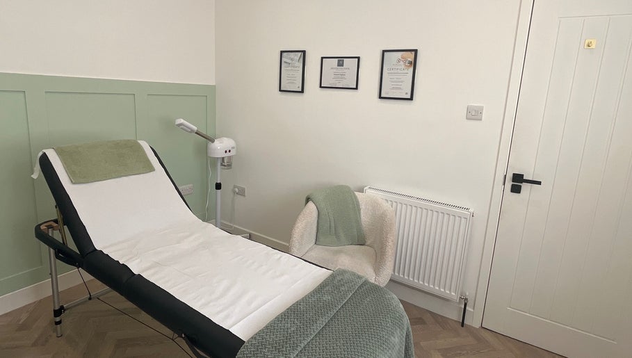 Relaxing treatment room at Flawless, Lostock Hall, England, GB with a comfortable bed and soothing decor.