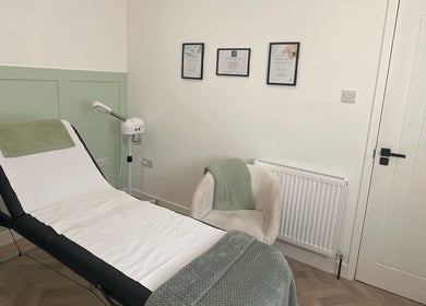 Relaxing treatment room at Flawless, Lostock Hall, England, GB with a comfortable bed and soothing decor.