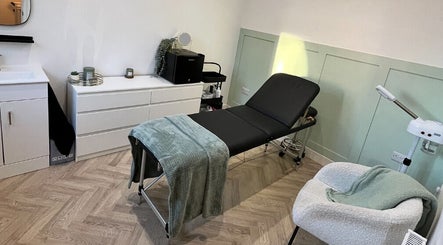 Flawless beauty room features a cozy treatment bed and modern decor in Lostock Hall, England, GB.