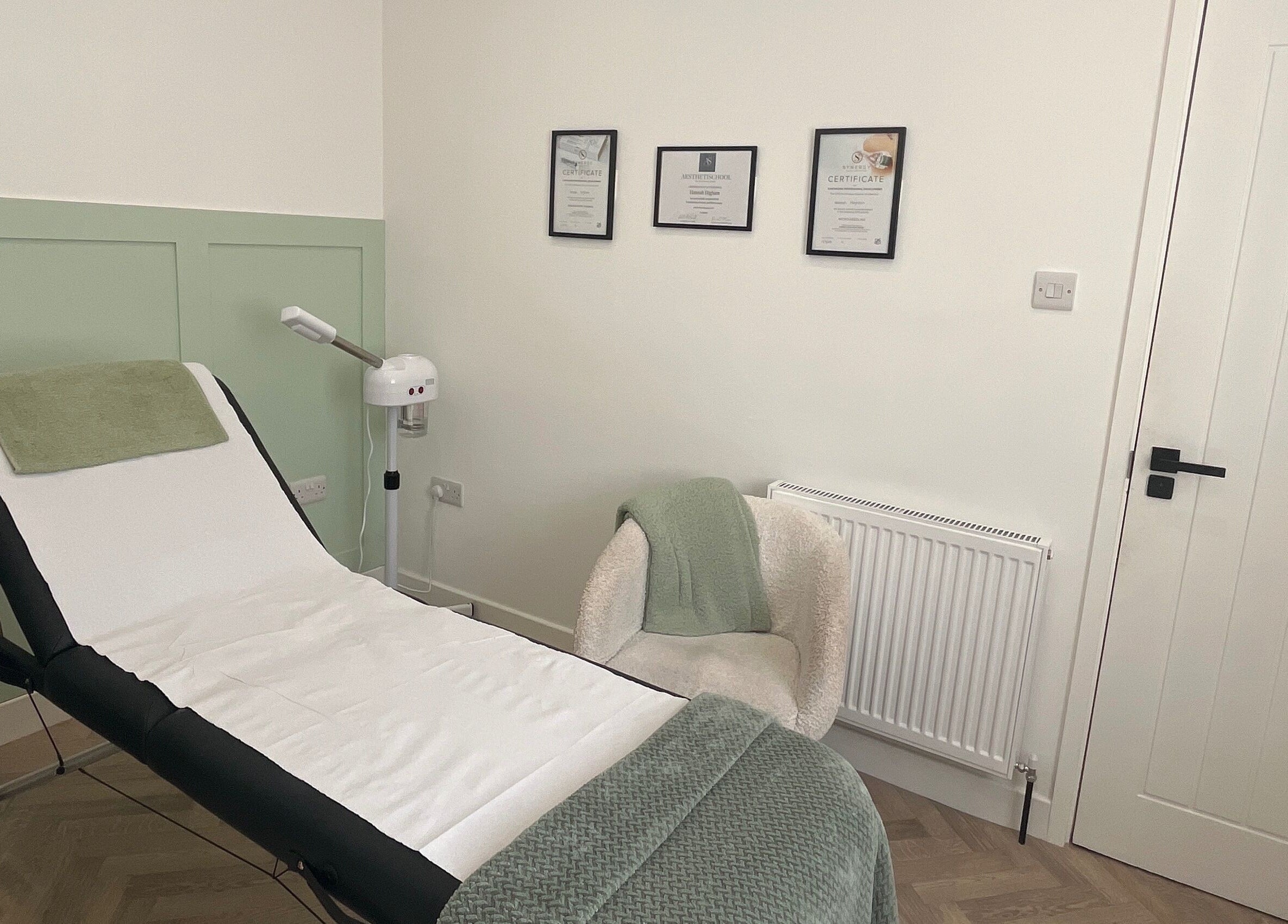 Relaxing treatment room at Flawless, Lostock Hall, England, GB, featuring a comfortable massage table.