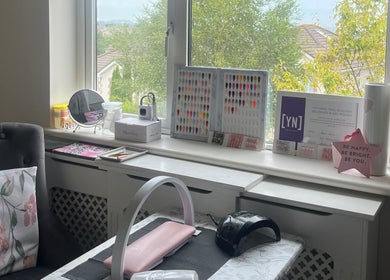 Inviting nail workspace at Nails by Jessica in Wicklow, County Wicklow, IE with tools and polish samples.