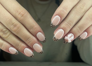 Leopard nail art with a 3D bow by Nails by Jessica in Wicklow, County Wicklow, IE.