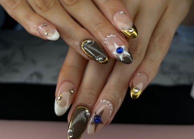 Close-up of intricate nail art at Nails by Jessica, Wicklow, County Wicklow, IE, featuring gold and jewel accents.