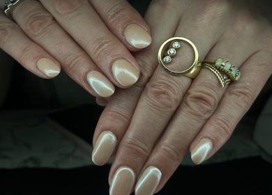 Close-up of a chic manicure with gold rings at Nails by Jessica, Wicklow, County Wicklow, IE.