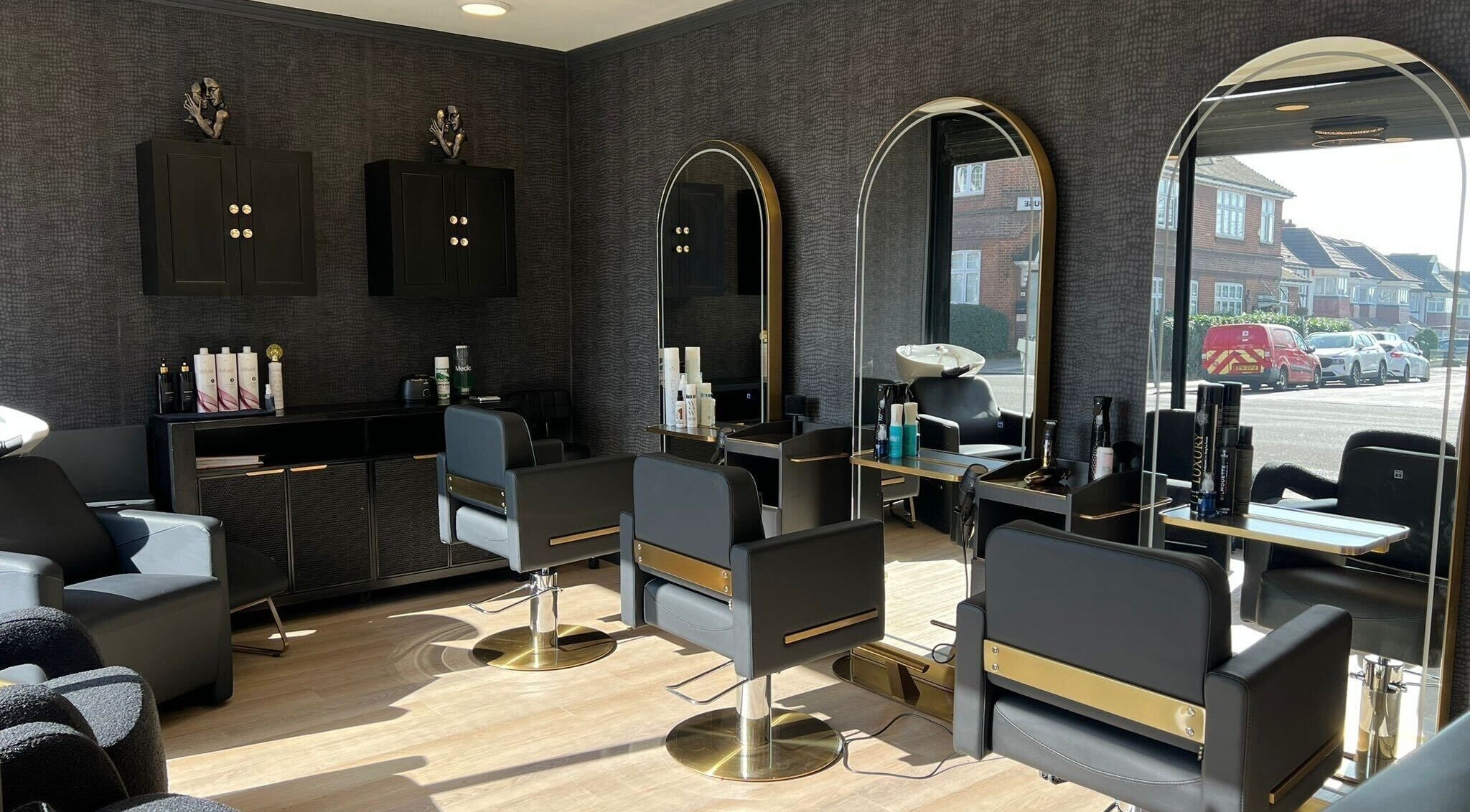 Modern styling chairs and mirrors at Svl Hair And Beauty in London, England, GB, creating a sleek salon ambiance.