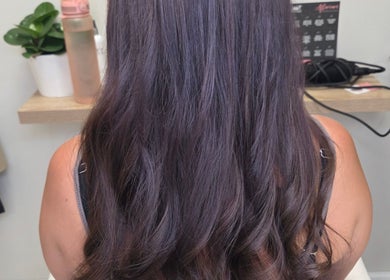 Long, shiny brown hair styled at Brow & Beauty in Mansfield, England, GB.