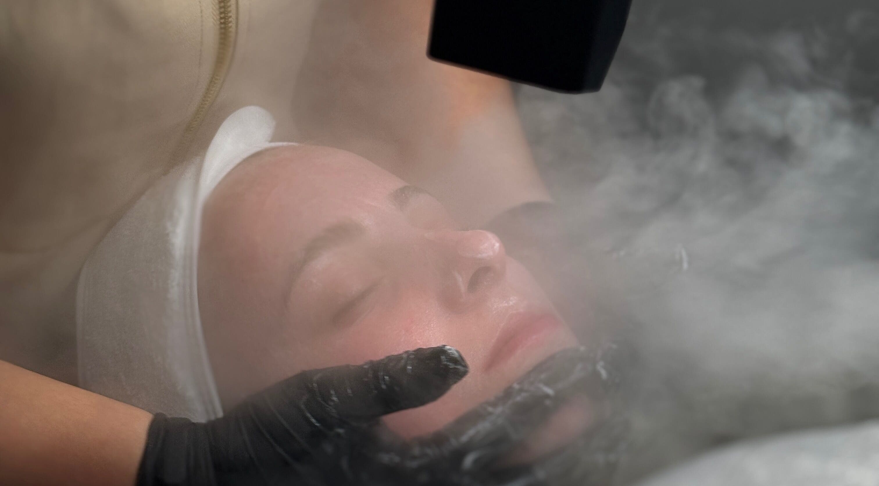 Rejuvenating facial treatment at Skin Club Co. in Motherwell, Scotland, GB, showcasing steam therapy.