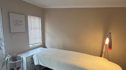 Cozy treatment room at Baebeauty in Kidderminster, England, GB with a soft massage bed and calming decor.