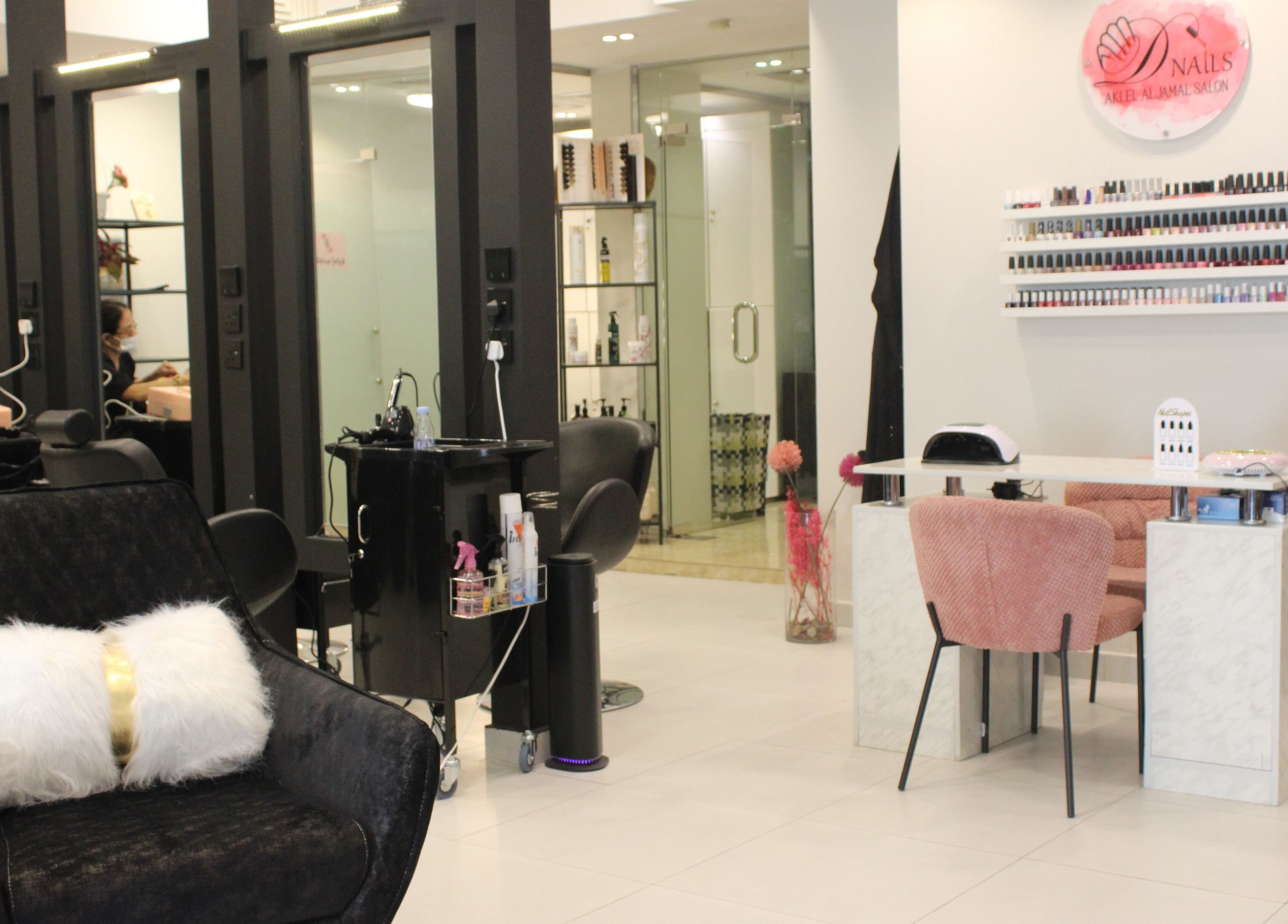 Aklel AlJamal Salon in Riyadh showcases a modern beauty station with elegant decor and nail polish display.