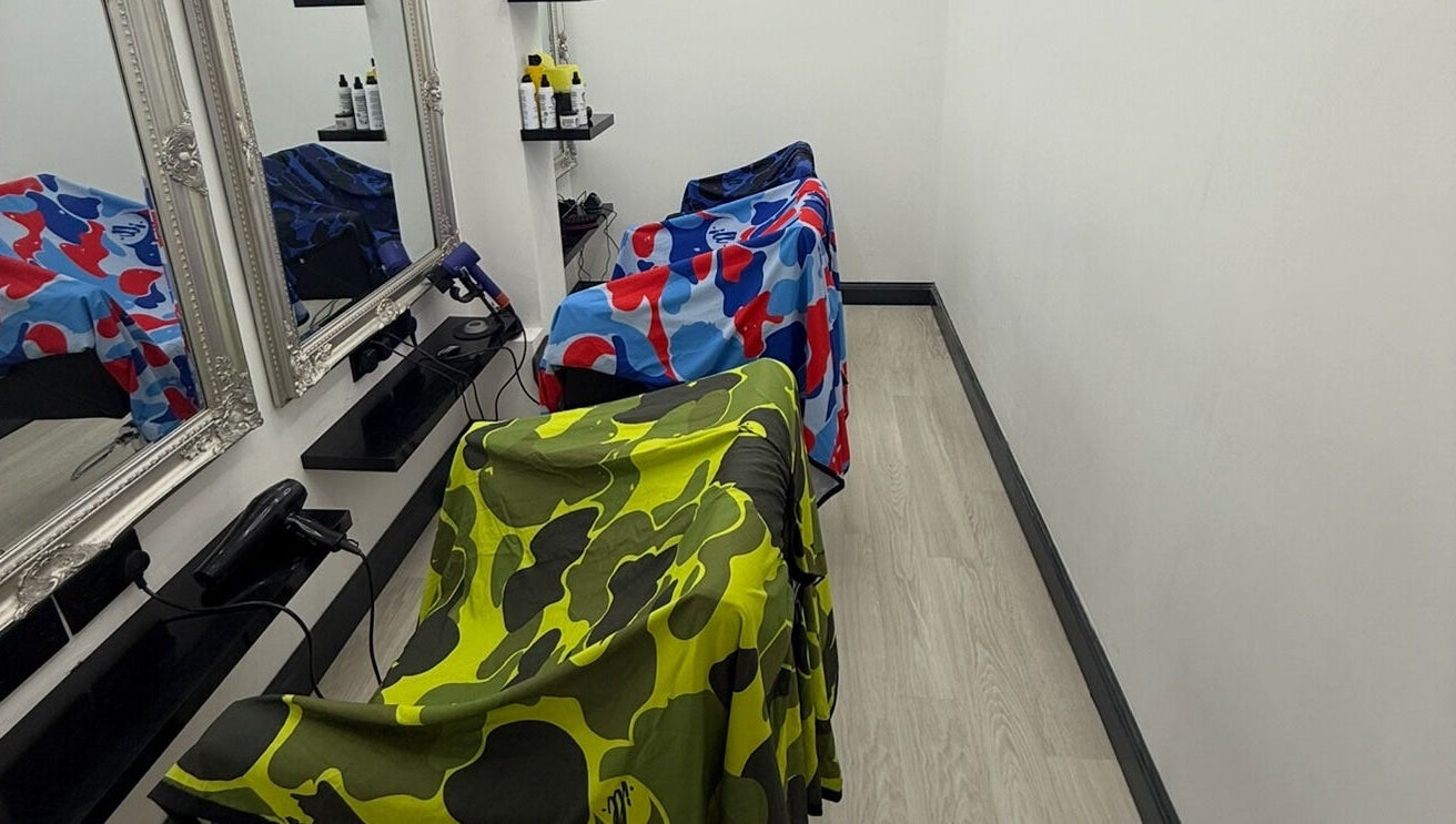 Vibrant salon chairs at MTB Studio, Birmingham, England, GB, enhance the modern beauty space.