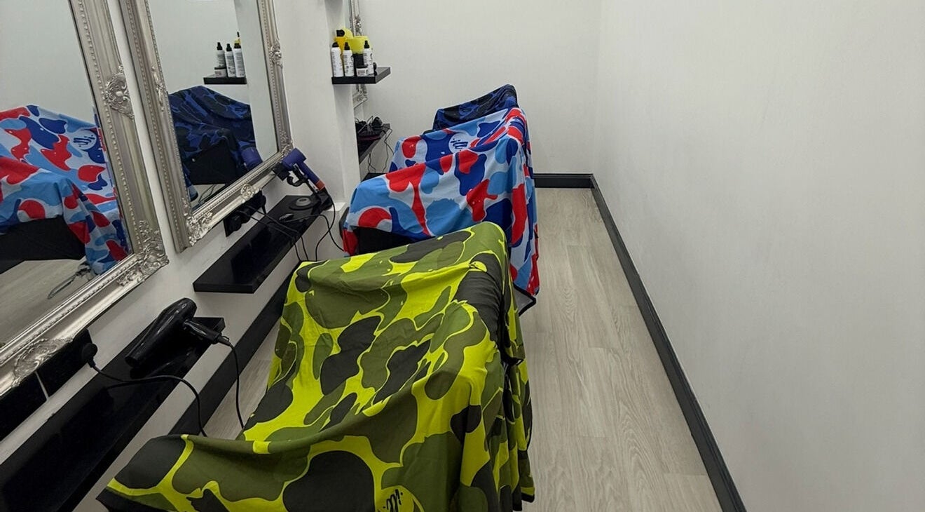 Vibrant salon chairs at MTB Studio, Birmingham, England, GB, enhance the modern beauty space.