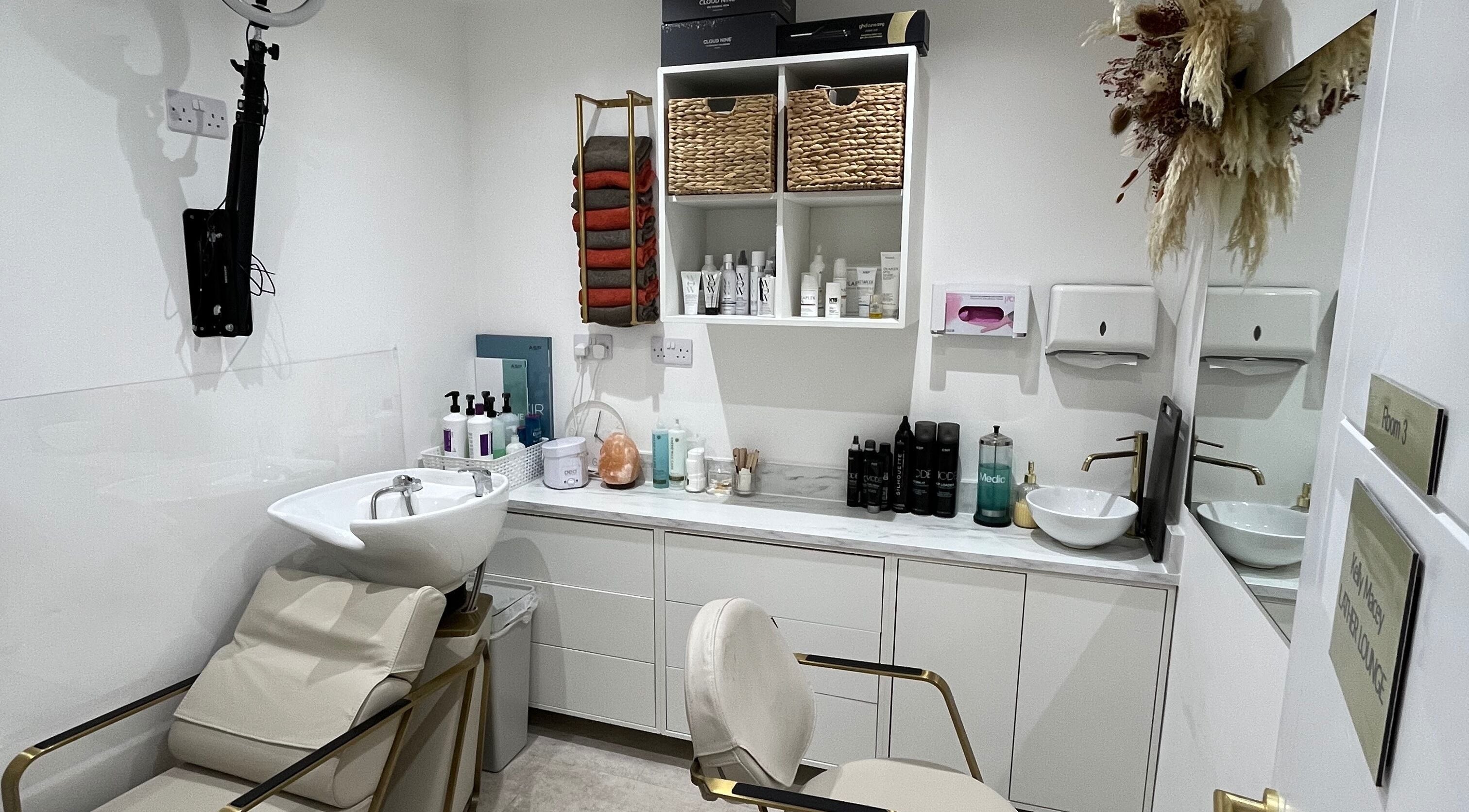 Lather Lounge wash station in Great Wyrley, England, GB with salon chair and elegant decor.