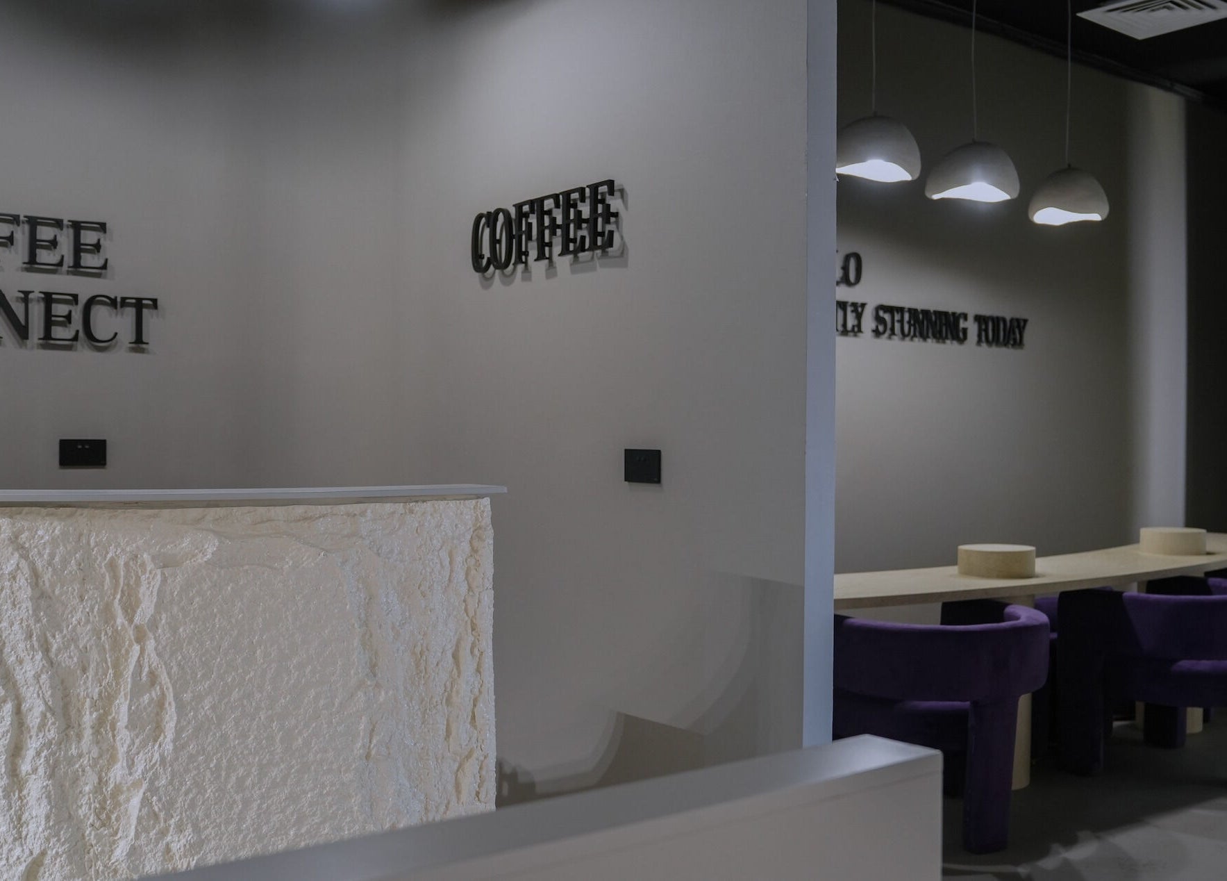 Reception area of Trèfle Spa in Al Ain, Abu Dhabi, AE with modern minimalist design and elegant seating.