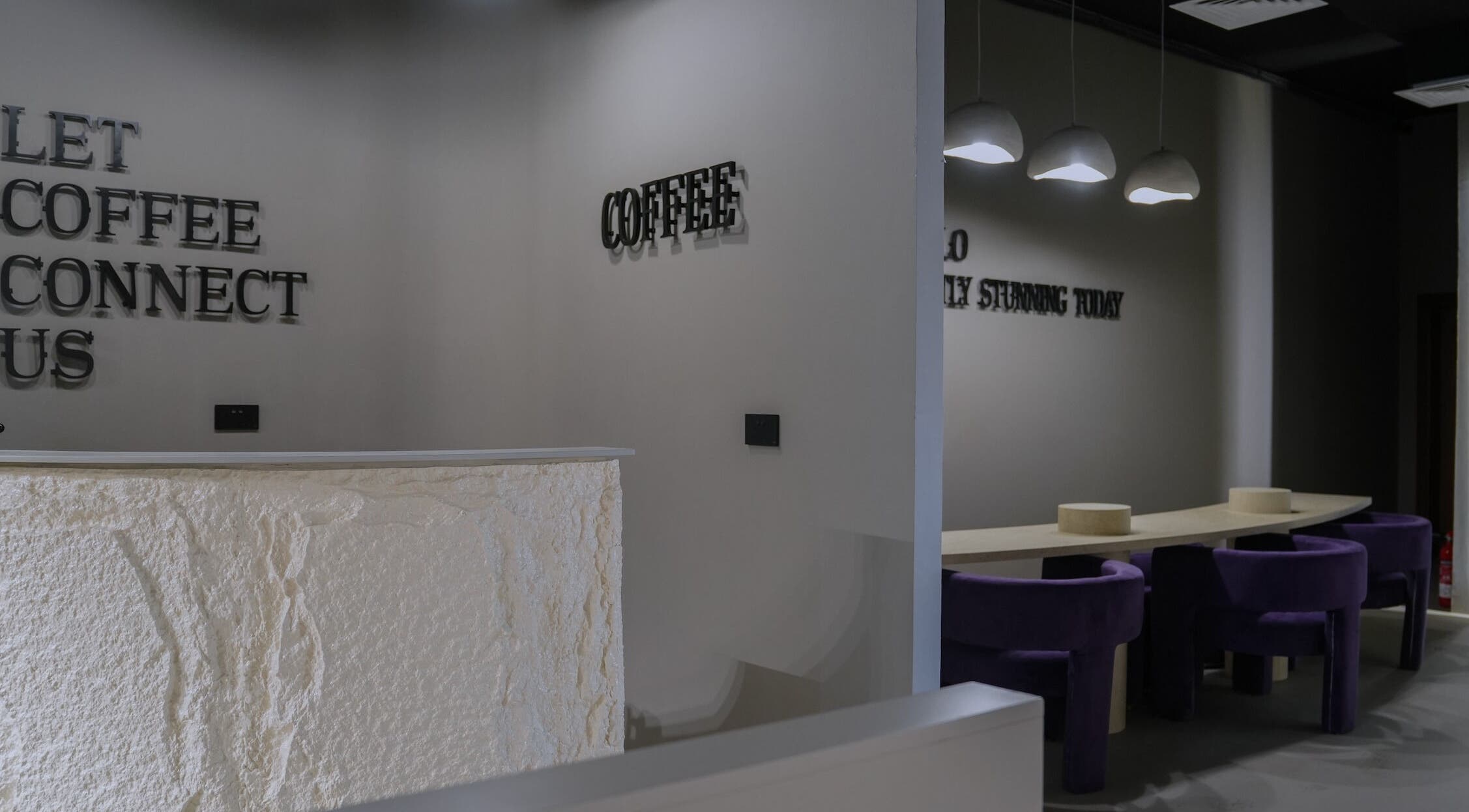Reception area of Trèfle Spa in Al Ain, Abu Dhabi, AE with modern minimalist design and elegant seating.