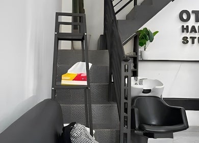 Stylish interior at Otw Hairstudio, Jawa Barat, ID, featuring elegant salon furniture and modern design.
