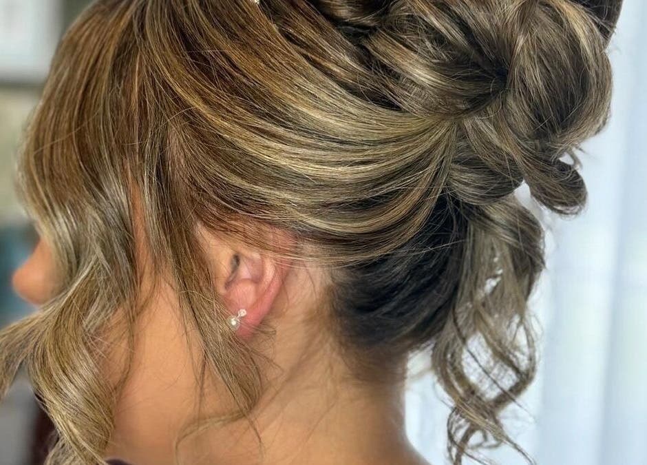 Beautiful updo hairstyle at Finesse Academy of Hair and Holistics, located in Haydock, England, GB.