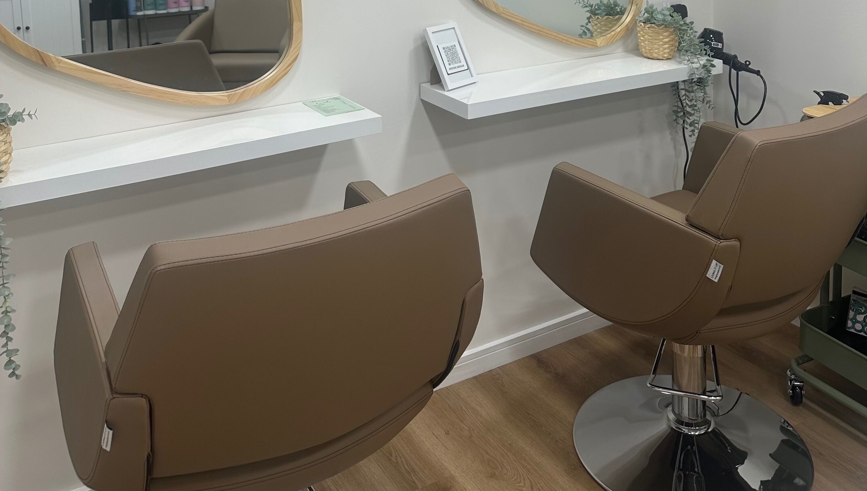 Stylish salon chairs at The View luxury home hair salon, Earley, England, GB, set for a premium hair styling experience.