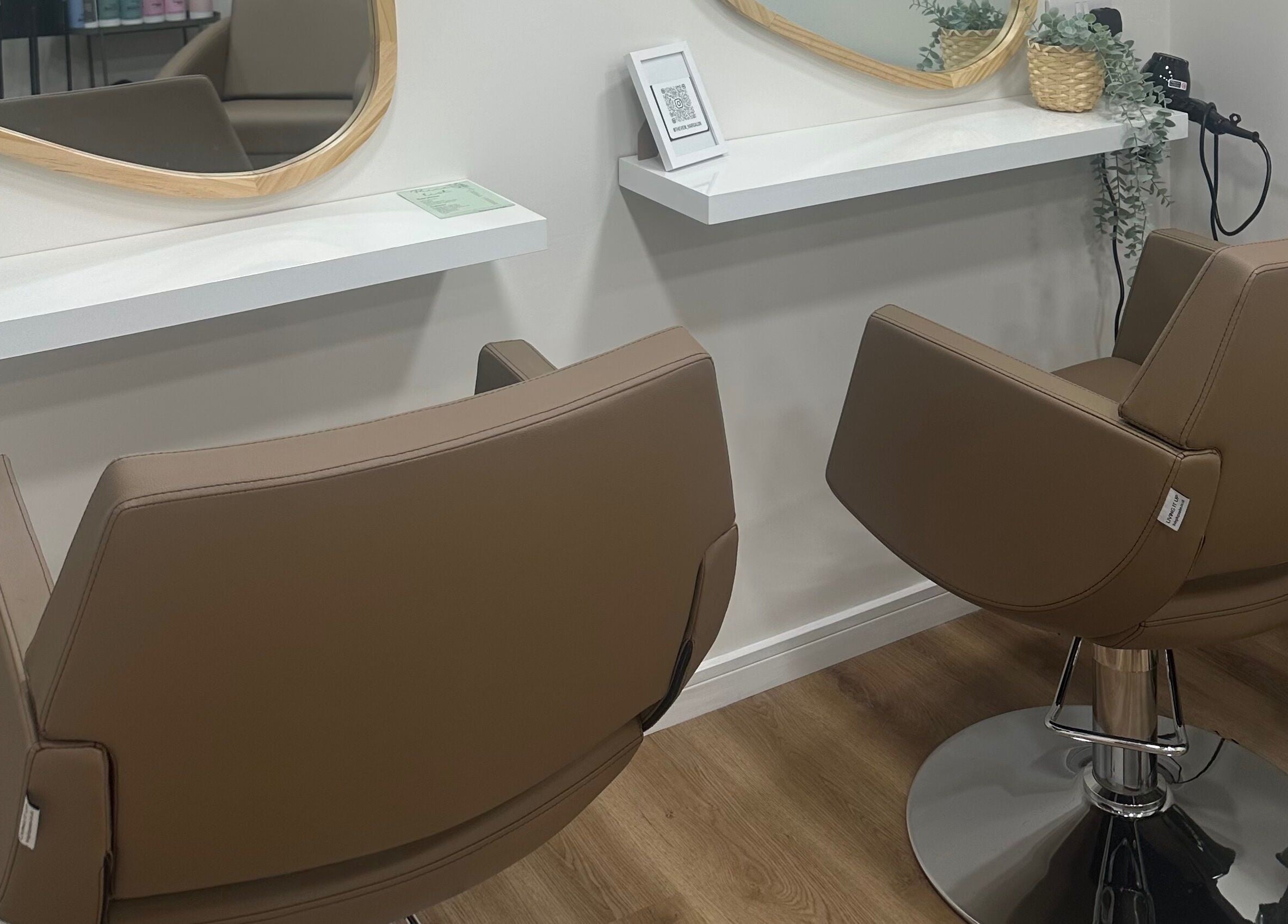 Stylish salon chairs at The View luxury home hair salon, Earley, England, GB, set for a premium hair styling experience.