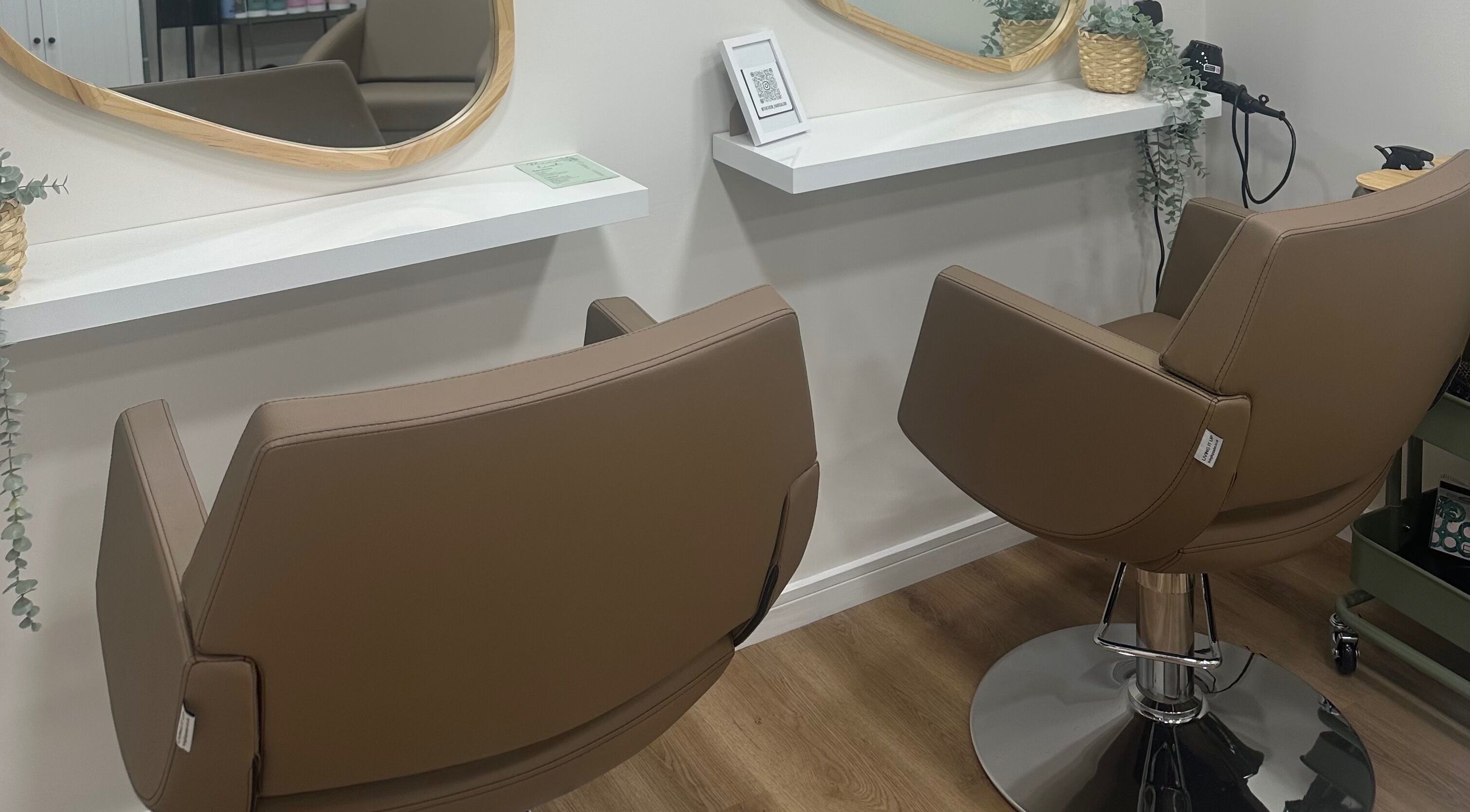 Stylish salon chairs at The View luxury home hair salon, Earley, England, GB, set for a premium hair styling experience.