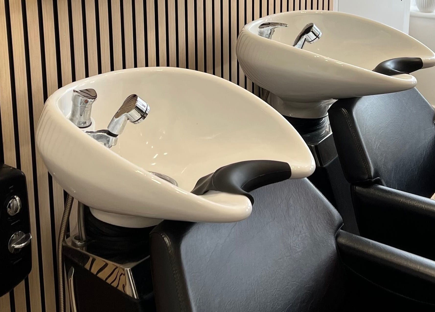 Modern wash stations at Extensions With Kirsty, Trowbridge, England, GB for relaxing hair treatments.