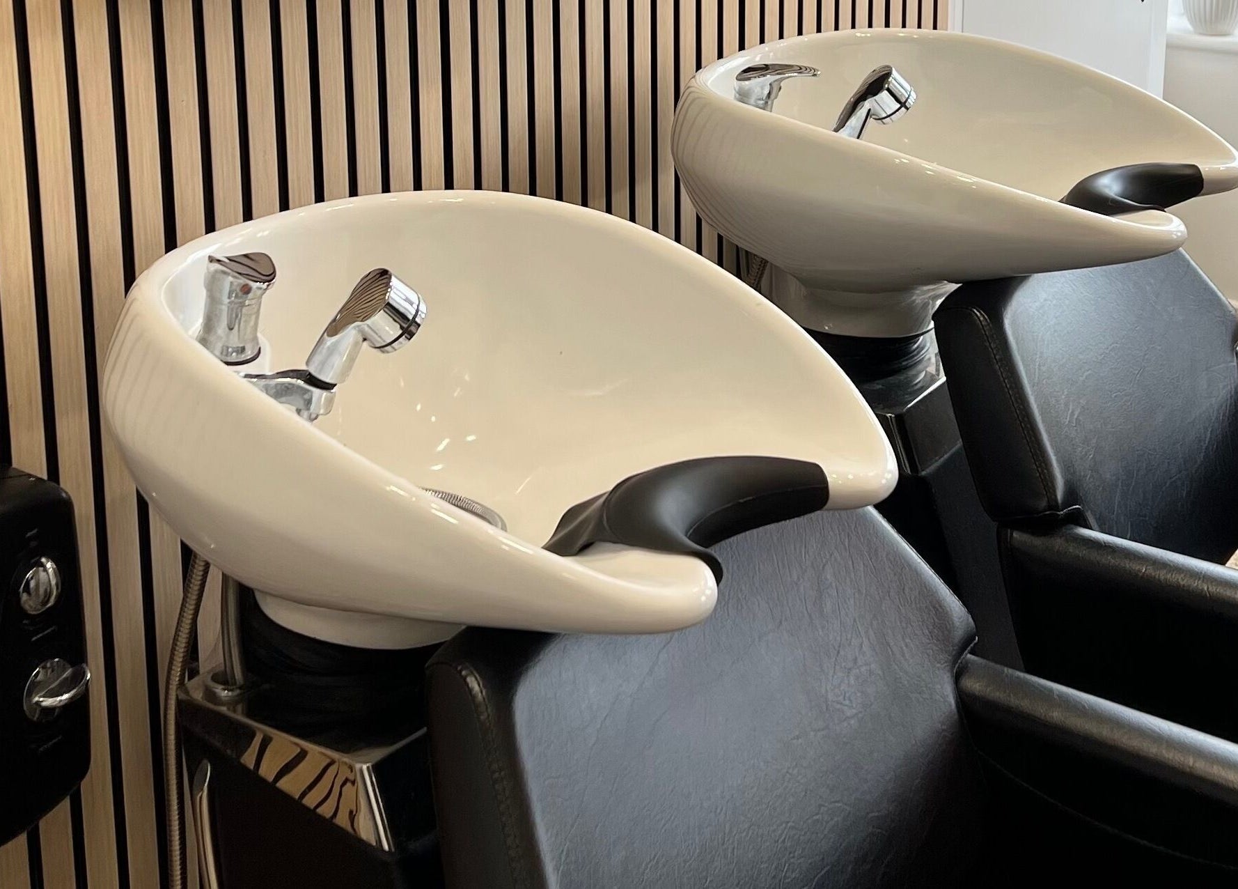 Modern wash stations at Extensions With Kirsty, Trowbridge, England, GB for relaxing hair treatments.