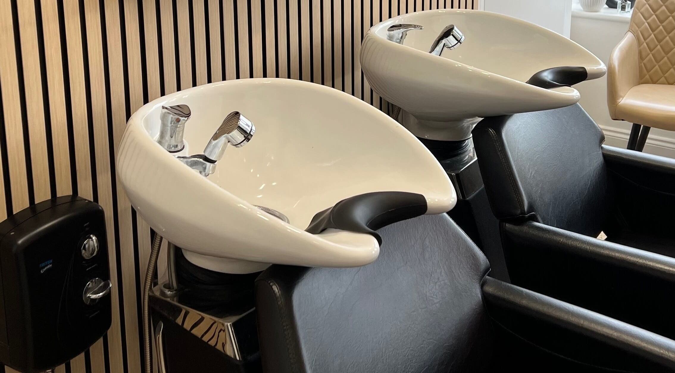Modern wash stations at Extensions With Kirsty, Trowbridge, England, GB for relaxing hair treatments.